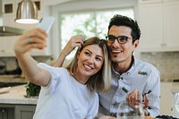Couple taking a selfie during their dinner