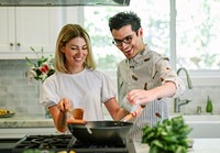 Happy couple cooking in the kitchen