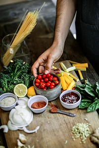 Fresh organic vegetables and ingredients prepared on a cutting board
