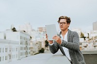 Man using a digital tablet at a rooftop in San Francisco