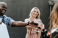 Cheerful friends toasting at a rooftop party