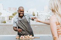 Chef toasting at a rooftop party