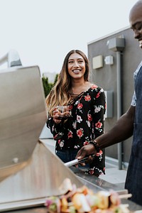 Cheerful woman enjoying at a barbeque party