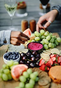 Closeup of a vegan cheese and fruit platter
