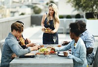 Woman serving vegan barbecue to her friends