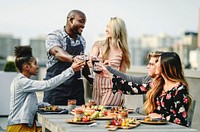 Gorgeous friends toasting at a summer party