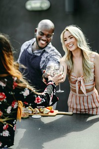 Gorgeous friends toasting at a summer party