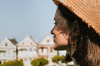 Woman enjoying a view of the Painted Ladies of San Francisco, USA