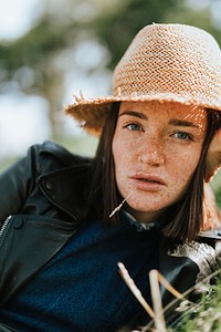 Portrait of a beautiful young woman with freckles