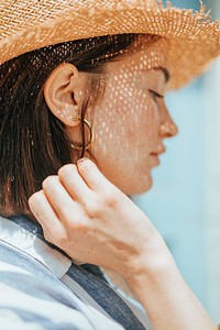 Portrait of a young woman with freckles