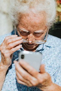 Senior woman reading from a mobile phone