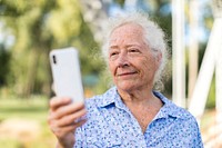 Sweet senior woman taking a selfie