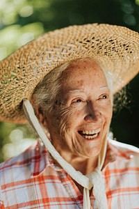 Portrait of a happy senior woman with a straw hat