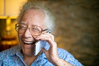 Happy senior woman talking on the phone
