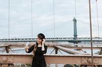 Woman taking a selfie on the Brooklyn Bridge, USA