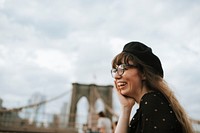 Cheerful woman on the Brooklyn Bridge, USA