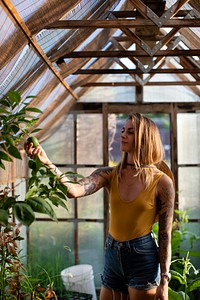 Beautiful woman in a greenhouse