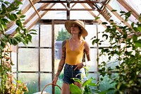 Beautiful woman in a greenhouse
