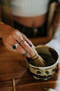 Woman preparing Japanese Matcha tea