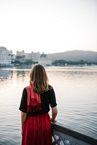 Western woman enjoying a view of Taj Lake in Udaipur