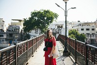 Western woman on a bridge at a city of Udaipur, India