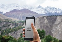 Mobile phone mockup design by the Himalaya mountains