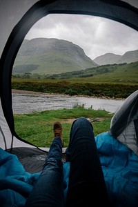 Waiting out the rain in a tent