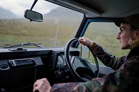 Man driving an old SUV in the Highlands