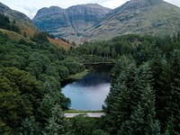 Jogger by a lake in the Scottish Highlands