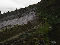 Hikers in the rough terrain of Glen Etive
