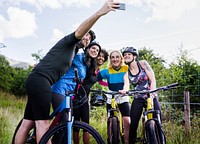Group of cyclists taking a selfie in the nature