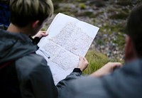 Woman searching for her location on a map