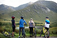 Group of cyclists by the riverside in the Highlands