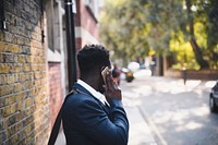 Businessman chatting on the phone in London