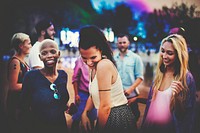 People dancing at a beach festival