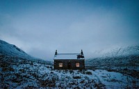 House covered with snow on a misty day