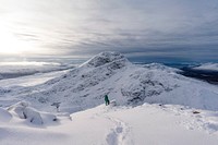 Female photographer on a snowy mountain