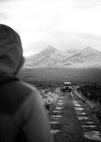 Man walking towards his car at Glen Etive, Scotland
