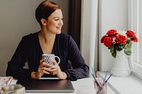 Business woman enjoying a mug of tea