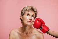 Senior woman getting punched in the face