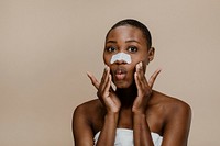 Black woman with a nose pore strip
