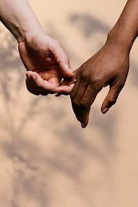 Diverse couple holding hands