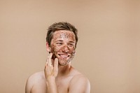 Happy man scrubbing his face