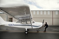 Aviation engineer checking a propeller plane