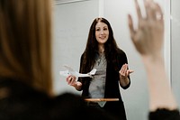 Woman explaining aerodynamics in a classroom