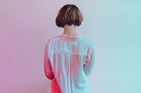 Rear view of a short dyed hair in a white shirt