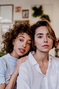 Lesbian couple relaxing in their house