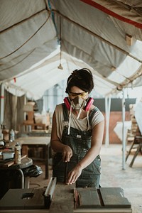 Female carpenter working in a workshop
