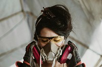 Female carpenter wearing personal protective equipment