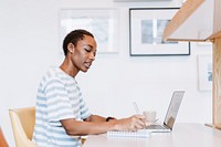 Black lady taking a note in a meeting